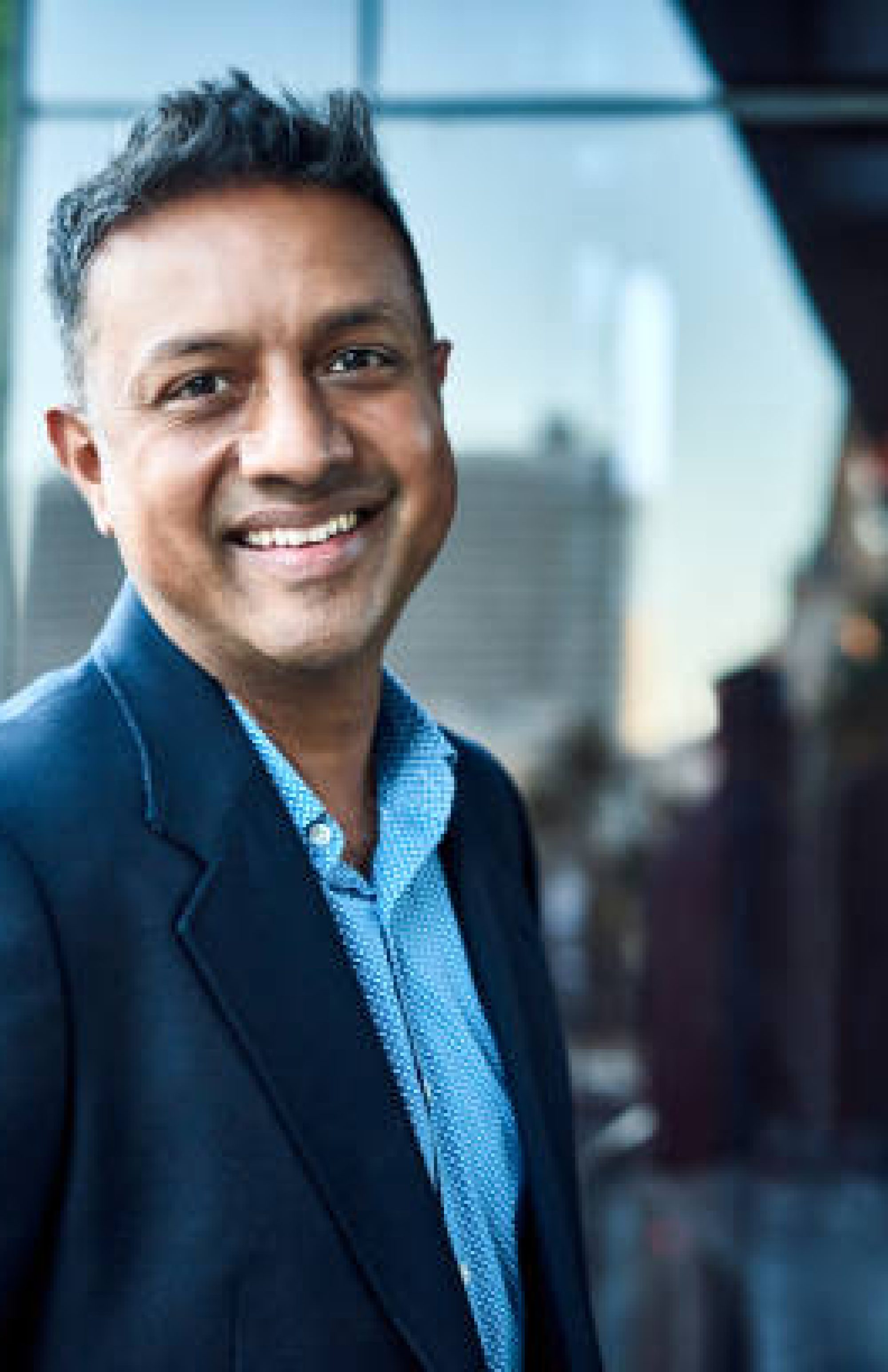 portrait of a confident businessman standing on an office balcony portrait of a confident businessman standing on an office balcony